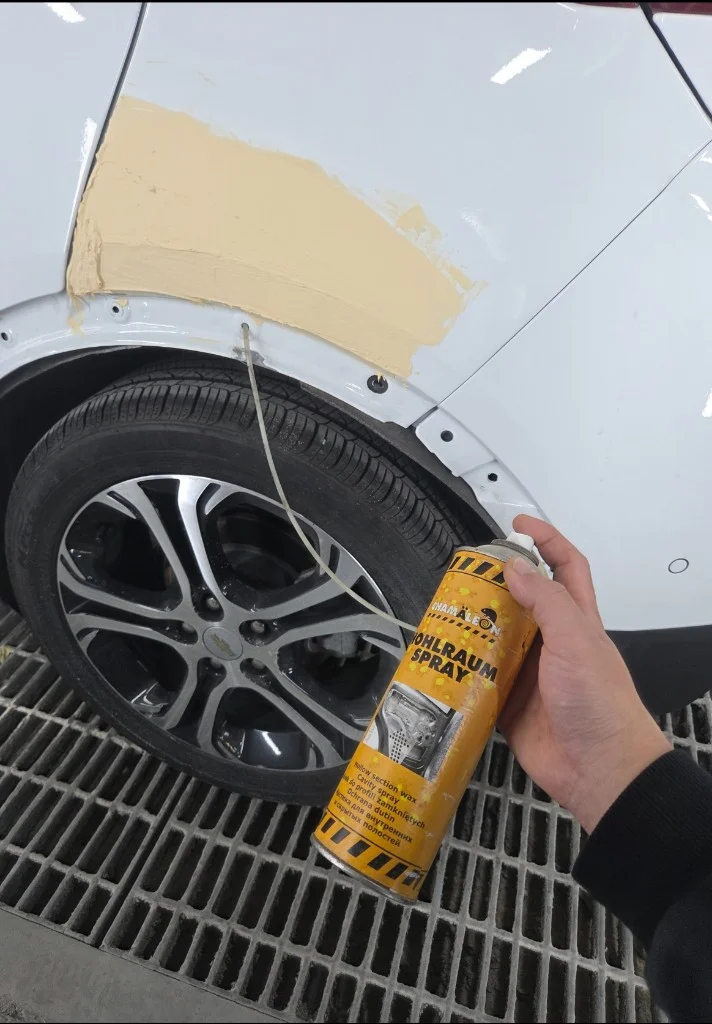 Repair in progress — cavity wax being applied