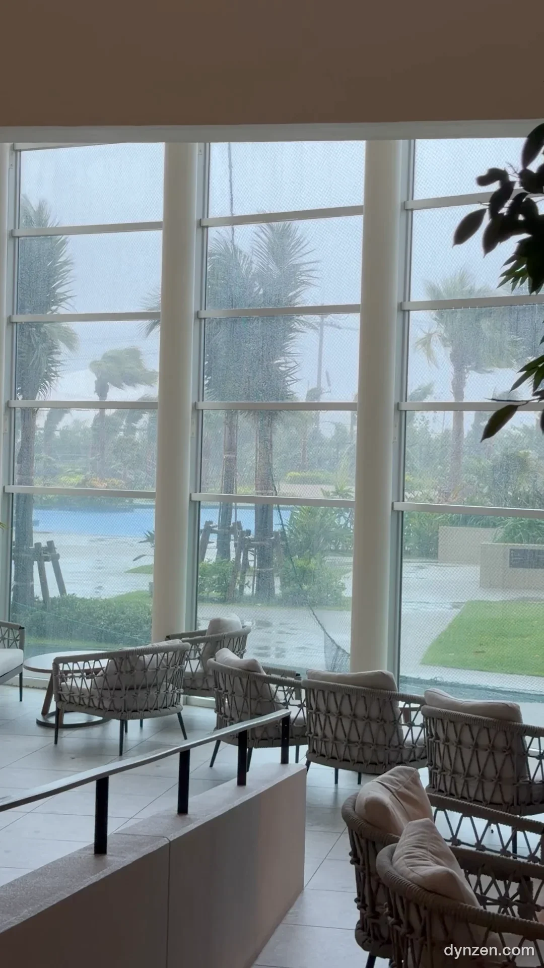 Storm visible through the floor-to-ceiling windows of the Grand Mercure Zanpa lobby